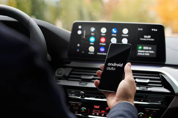 How to watch netflix on android auto - A man is connecting the car screen with Android Auto